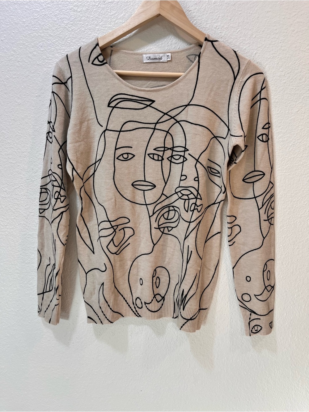 Damod Beige Crewneck Sweater with Black Abstract Face Line Art